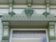 The top of the window treatment, with corbels and hand carved elements