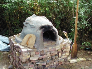 Old Time Cooking: Our Cob Oven was built by students from Humboldt State University and is used to cook homemade bread and pizza