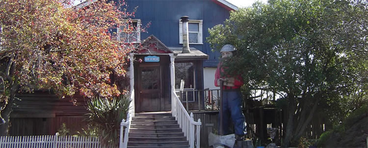 The legendary Paul Bunyan poses next to the Blue Ox main office